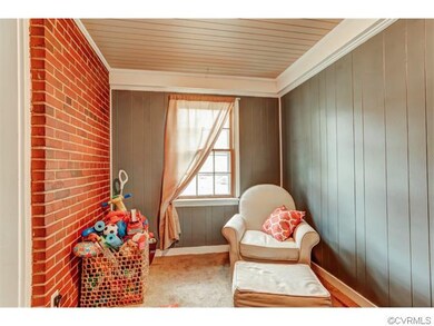 This charming room with exposed brick would make t