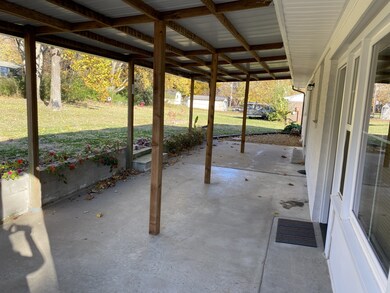 Covered Patio across the back of the home. The middle post are not bolted so you can remove them for more functional space to entertain family and friends