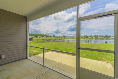 Unfurnished sunroom with a water view