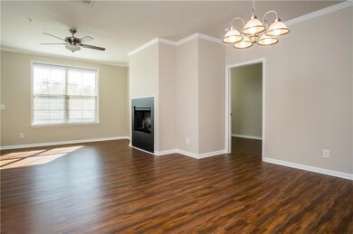 Unfurnished living room with ceiling fan with nota