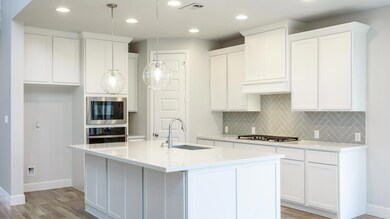 Kitchen featuring appliances with stainless steel