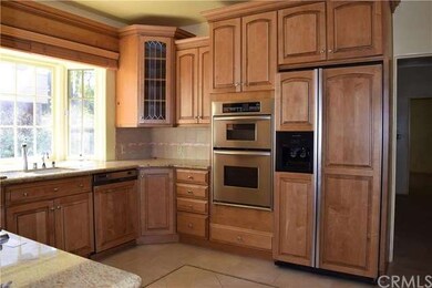Remodeled kitchen with newer appliances, granite c