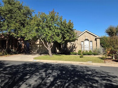 View of front of house with driveway, a front yar