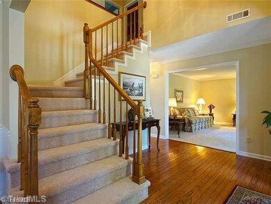 Entry. Foyer opens up to 2 story entry with Hardwoods and natural light.