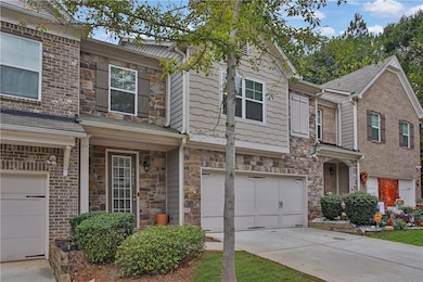 Townhome / multi-family property featuring a garag
