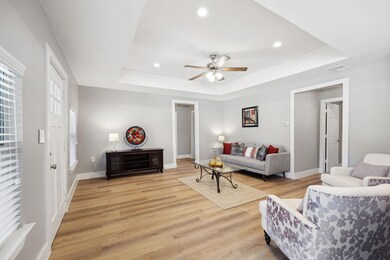 Living room with light hardwood / wood-style floor