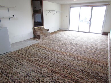 There is a separate den which has an exterior door leading to the driveway