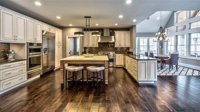 The wonderfully equipped chef's kitchen is airy an