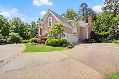 View of side of home featuring concrete driveway, 