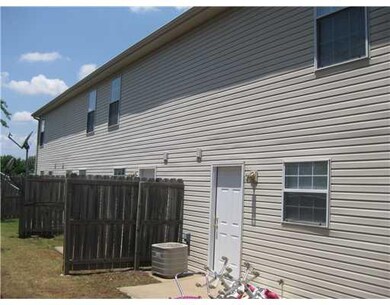 Exterior Back. Nicely finished exterior, individual A/C for each unit.