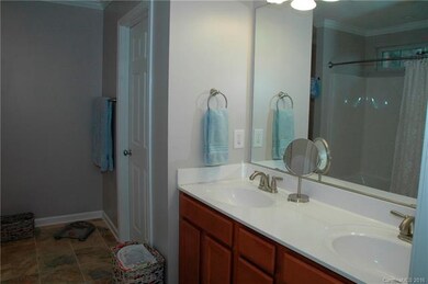Ceramic tile floors, Double sink, water closet.