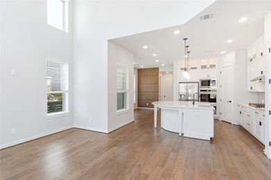 View of kitchen from living room/entry.
