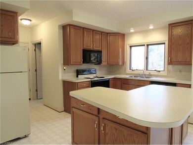 The kitchen has a nice size island with sitting sp