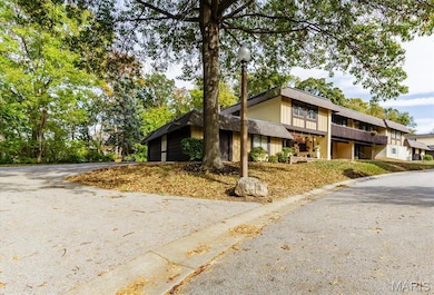 Mid-century inspired home featuring driveway
