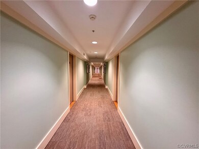 Hall with light colored carpet