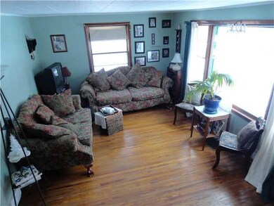 Living Room Gleeming hard wood floors in spacious 