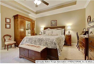 Master bedroom features tray ceiling.