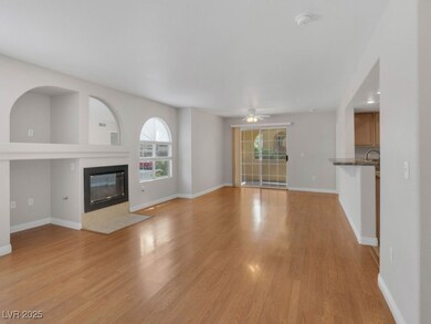 Unfurnished living room featuring ceiling fan, lig