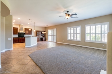Unfurnished living room featuring light tile patte