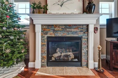 Beautiful stone-faced vented gas fireplace; lovely