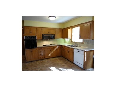 Well-lit Open Kitchen With New Ceramic Tile