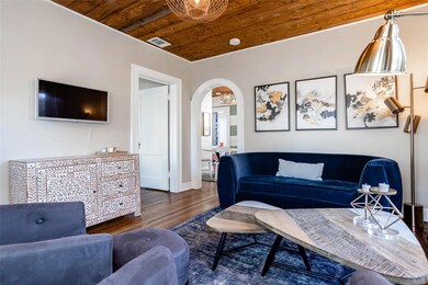 Living room with wooden ceiling, wood finished fl