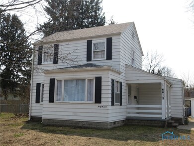 Covered front porch, room for a bistro table and c
