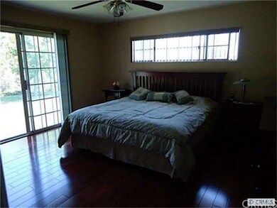 Master bedroom with access to back yard