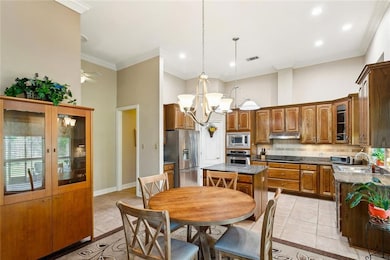 Breakfast area overlooks the screened patio and ya