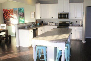 Gorgeous Kitchen yet extremely practical - with Gourmet Island, upgraded cabinetry, and soft close drawers.  Large Pantry.