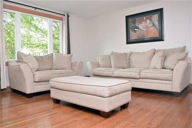 Freshly Painted, Bright Living Room Boast Hardwood