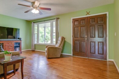 A picture window lets light flow in and provides the perfect vantage point to watch the birds on the front lawn and the butterflies around the butterfly bush.