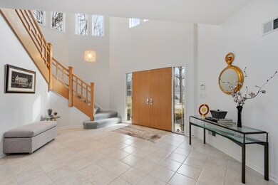 Inviting 2-Story Foyer Opens to Living Room, Dinin