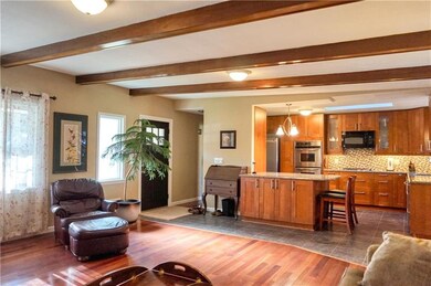 Sun splashed living area with new windows, new ext