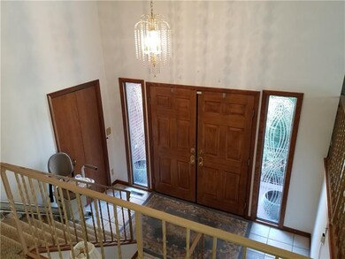 Open foyer with upgraded double door entrance
