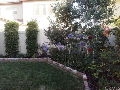 Professionally landscaped with easy care brick acc