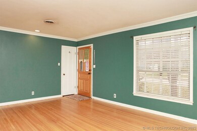 Large picture window and coat closet in the family