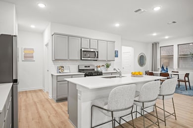 Kitchen in a Trinity Ranch Oak Model home in Elgin TX by Trophy Signature Homes