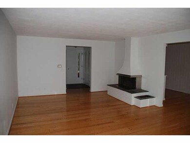 Living Room Off white walls, gleaming wood floors,