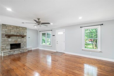 Unfurnished living room with hardwood / wood-styl