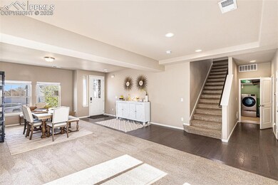 Foyer entrance with visible vents, washer / dryer,