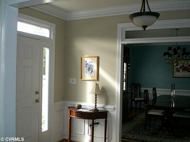 Foyer - Hardwood floor, crown molding, transoms an