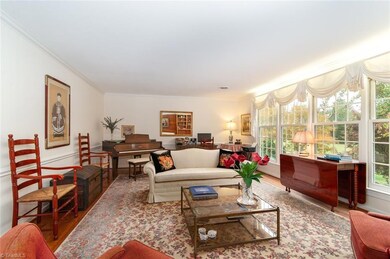 Living Room has a full wall of windows to enjoy the golf course view.