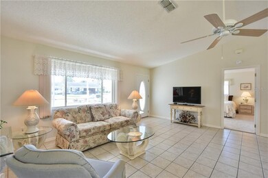 Living room with Tile Flooring and Ceiling Fan