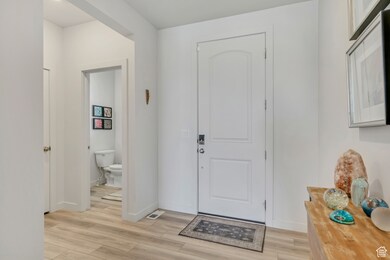 Foyer featuring light wood finished floors