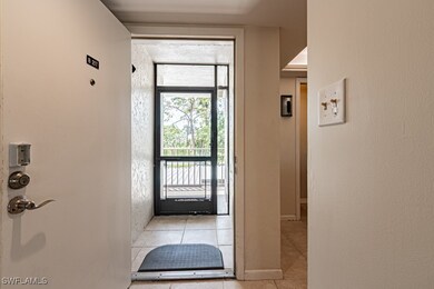 Doorway to outside with baseboards and light tile