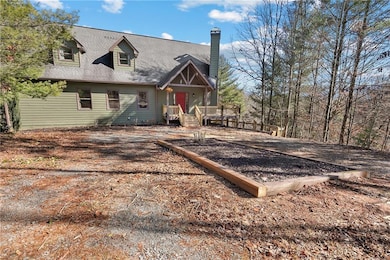 View of front of house with a wooden deck