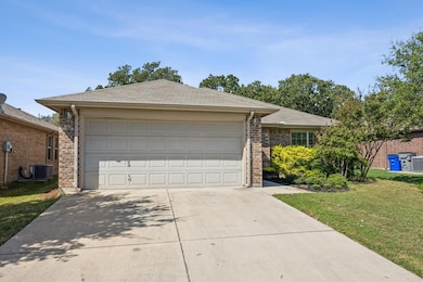 Ranch-style house with a garage, central air condi