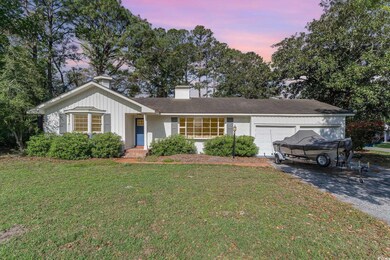 Single story home featuring an attached garage, br