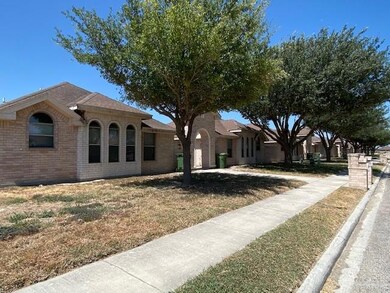 View of front of house featuring brick siding and a front yard